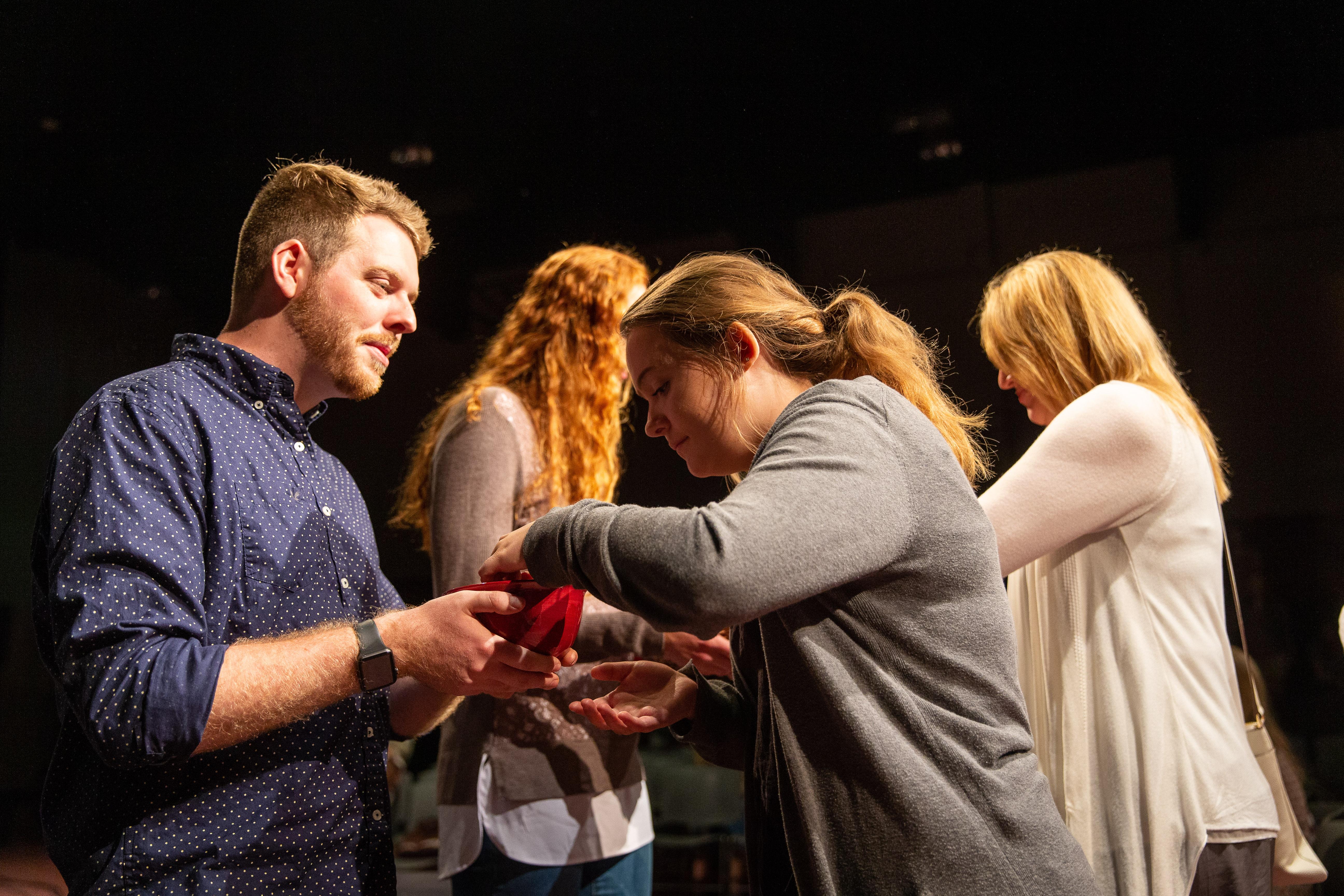 students helping at church